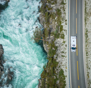 Aerial View of a Camper Van RV on the Scenic Norwegian Road