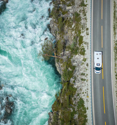 Aerial View of a Camper Van RV on the Scenic Norwegian Road
